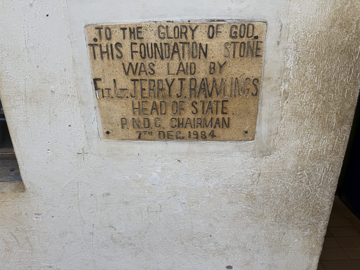 Foundation stone plaque dated 7th December 1984 on a school wall