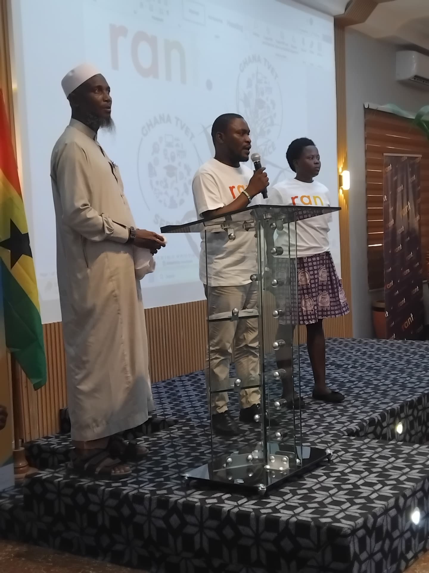 Community and faith leaders joining RANT presenters at the podium during the launch