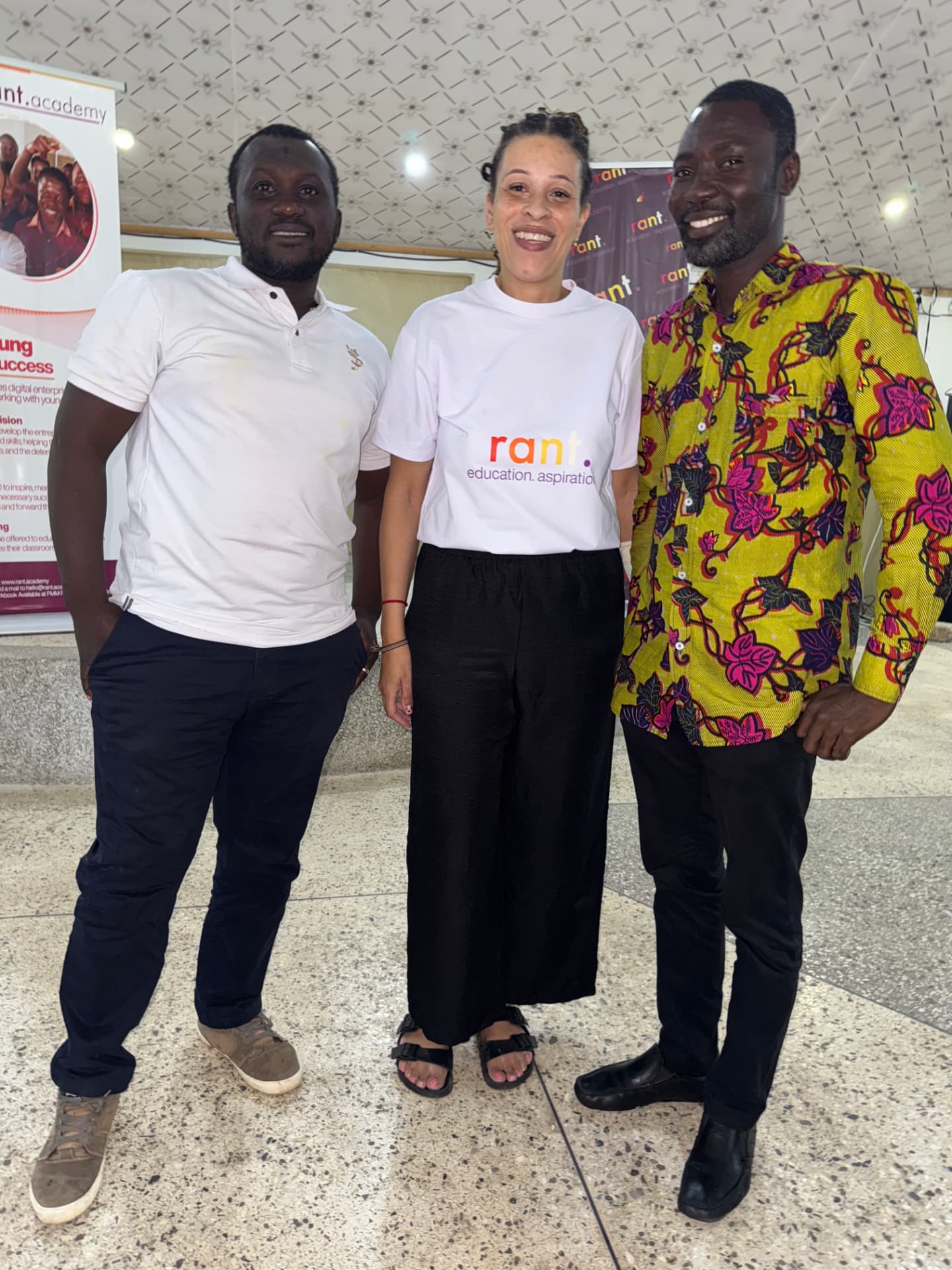 Three members of the RANT delivery team standing together after a session