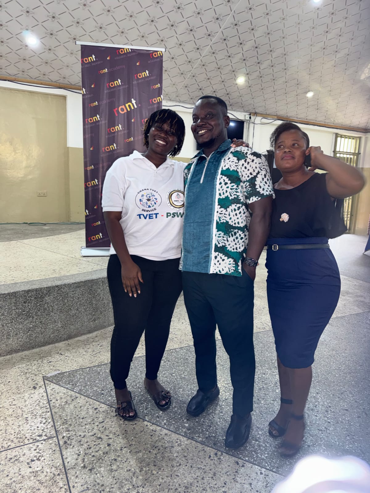 Three TVET partners standing together in front of a RANT Academy banner