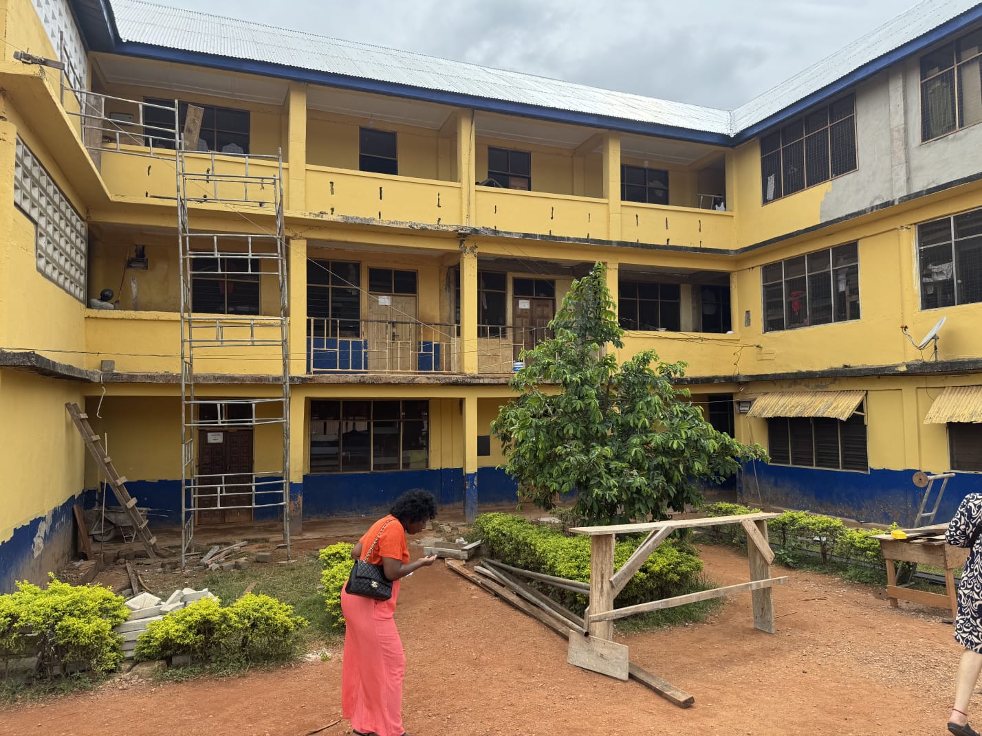 Courtyard of a technical institute with workshop benches and scaffolding